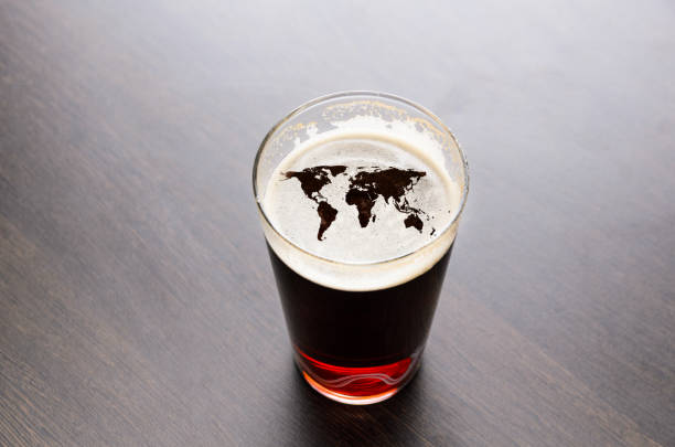 istock World map silhouette on beer glass 695611672