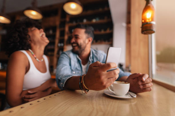 istock Young couple enjoying at coffee shop 695612110