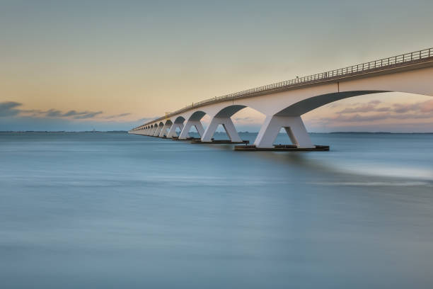 Zeeland bridge at sunset - long exposure photo stock photo