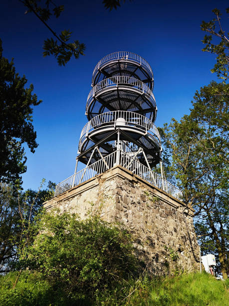 istock metal lookout tower named Varhost in spring czech evening landscape 695622544