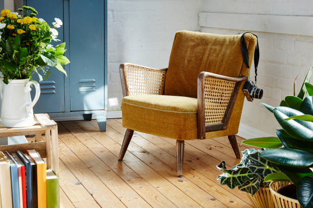 istock vintage easychair with camera in indutrial loft 695625504