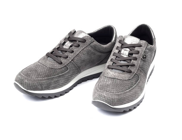 istock Gray female suede sneakers isolated on white background with clipping path 695633208