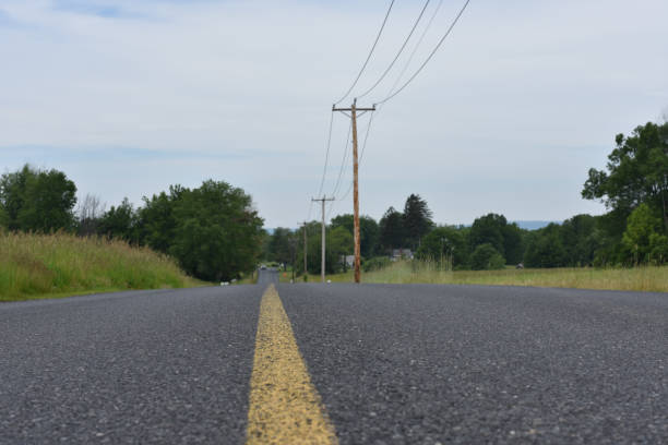 istock yellow line in country road 695633654