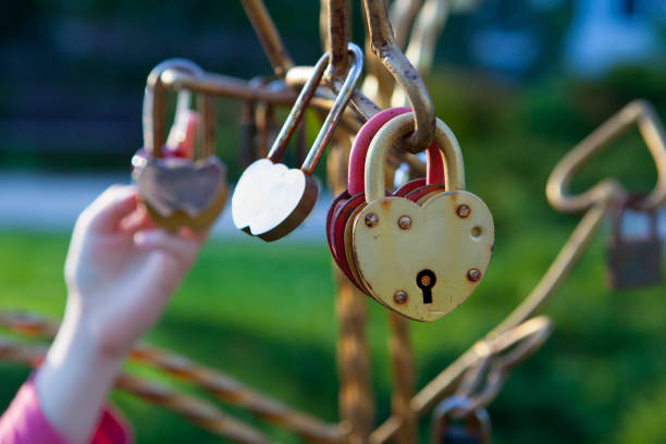 The girl is holding the lock