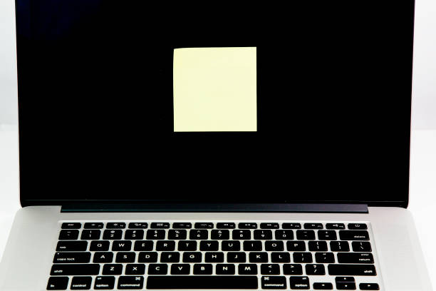 istock Note on laptop screen. Empty yellow adhesive papers on laptop 695637442
