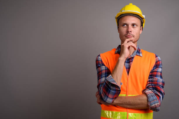 istock Studio shot of man construction worker against gray background 695641222