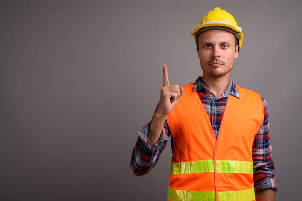 istock Studio shot of man construction worker against gray background 695641622