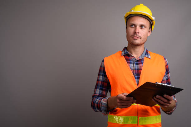 istock Studio shot of man construction worker against gray background 695641706