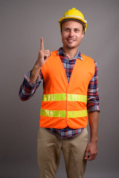 istock Studio shot of man construction worker against gray background 695641710
