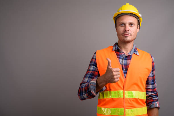 istock Studio shot of man construction worker against gray background 695641734