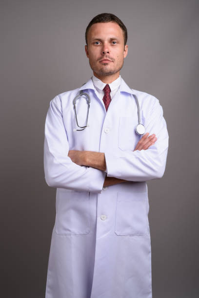 istock Studio shot of man doctor against gray background 695645012