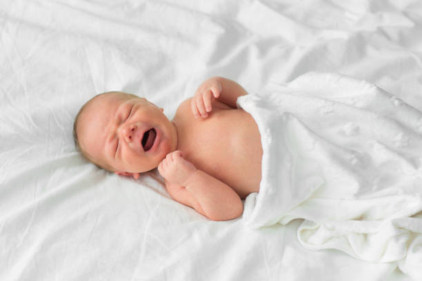 istock The newborn cries. One week age 695645020