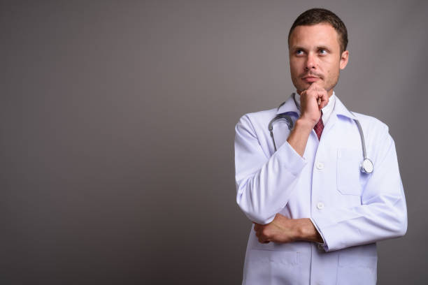 istock Studio shot of man doctor against gray background 695645242