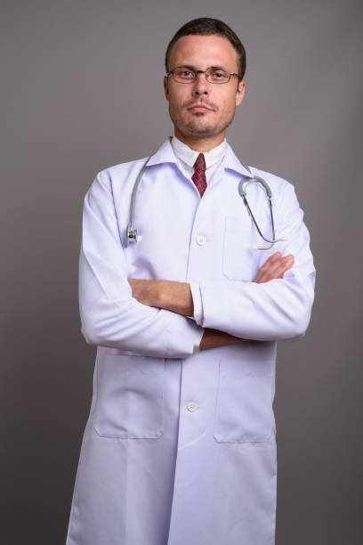 istock Studio shot of man doctor against gray background 695646128