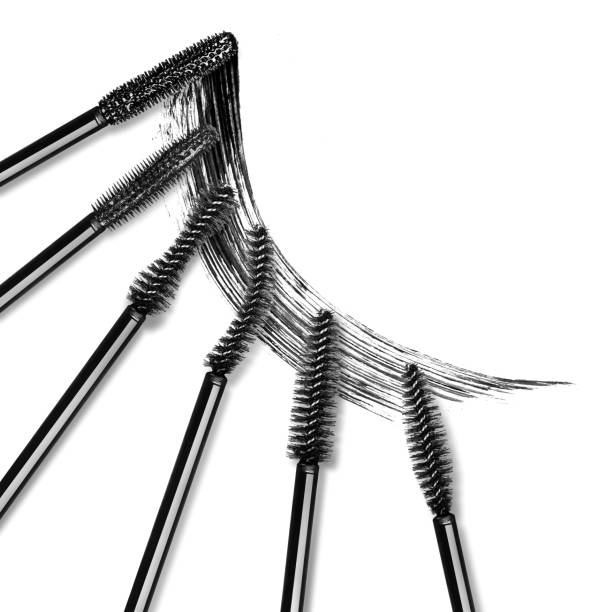 istock Set of various mascara brushes with mascara stroke on white background 695656162