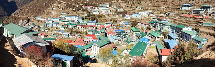 Panoramic view over the rooftop of the teahouses homes of Namche Bazaar, the Sherpa village and trading post high in the Himalayan mountains of Nepal.