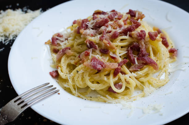 istock Pasta Carbonara. Spaghetti with bacon and parmesan cheese. 695685374