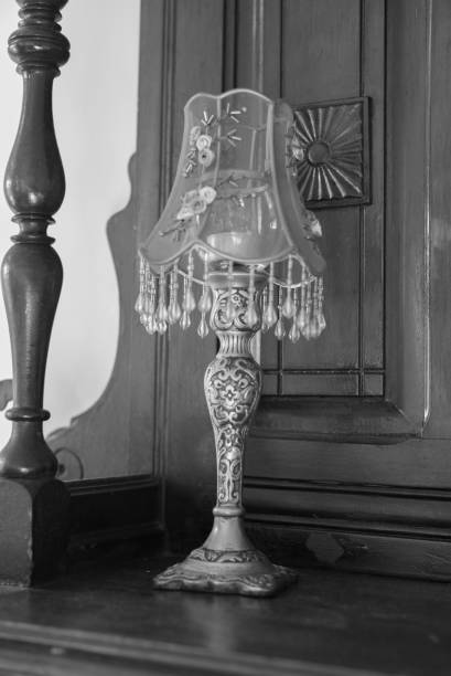 istock Vintage lamp on wooden mantel 695685660