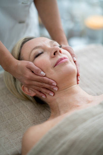 istock Woman getting a facial massage at the spa 695685948