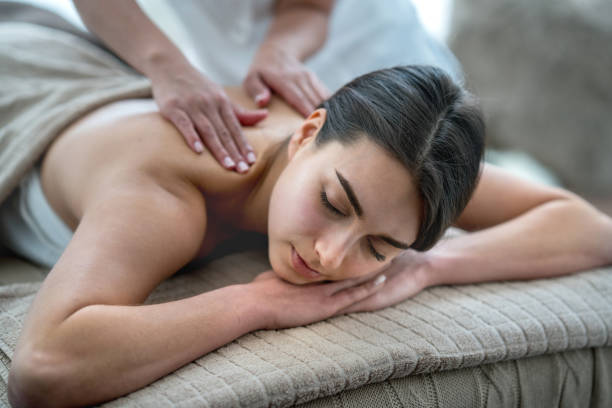 istock Beautiful woman getting a massage at the spa 695686084