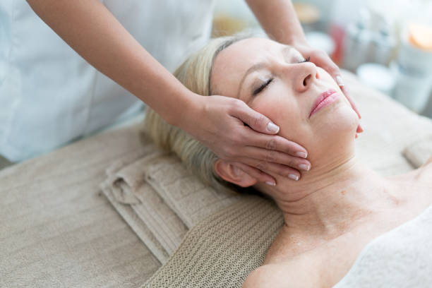 istock Woman getting a facial at the spa 695686094