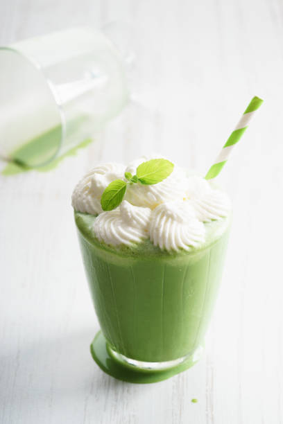 istock Freshly blended green smoothie in glass 695686190