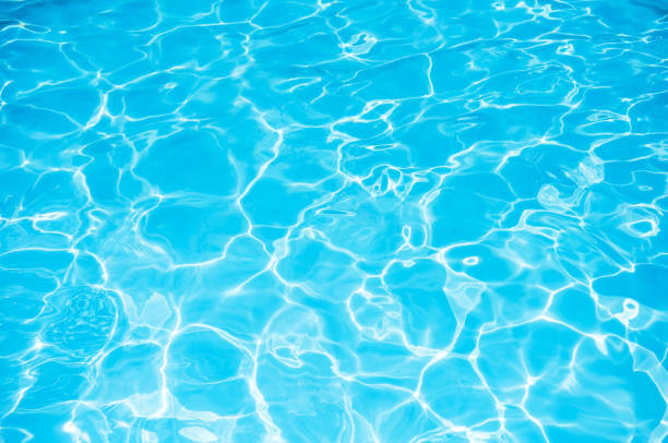 istock Beautiful ripple wave and blue water surface in swimming pool 695686266