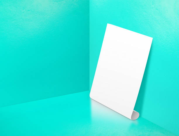 istock Blank white rolling poster at corner painted pastel turquoise color studio room background,Mock up template for display or montage of design or text ,Online marketing media tool 695686450