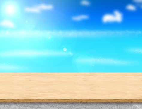 Wood table top and marble base with blurred sea,sun and beach at background, Mock up template for display or montage of your product, Summer holiday concept.