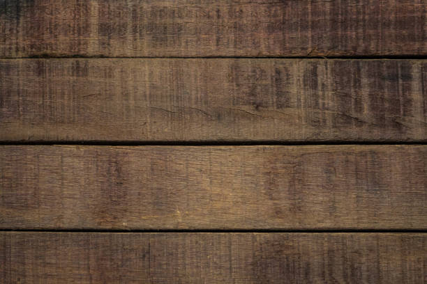 istock Vintage surface wood table and rustic grain texture background. Close up of dark rustic wall made of old wood table planks texture. Rustic brown wood table texture background template for your design. 695708612