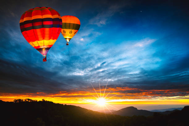 Colorful hot-air balloons flying over the mountain