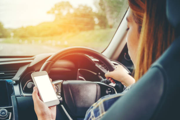 istock Woman traveler Using Smart Phone Car Inside 695721050