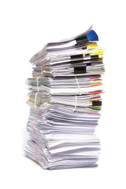istock Stack of business papers isolated on white background 695722480