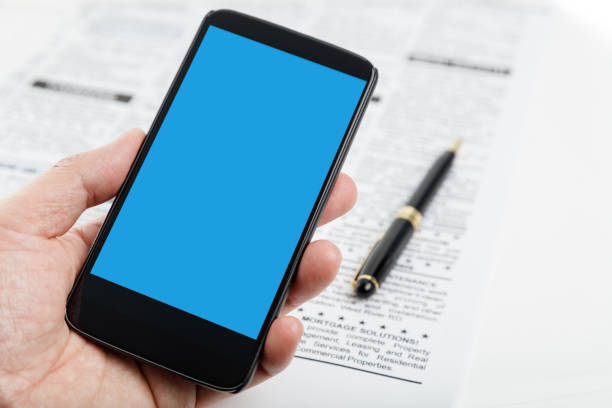 istock fake newspaper and smartphone 695722572
