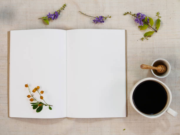 istock Note book paper and coffee on white cloth 695740508