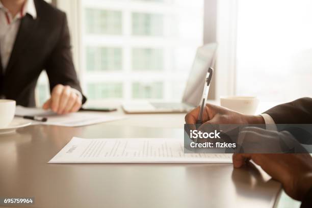 Male Hand Putting Signature Signing Partnership Contract Concept Close Up Stock Photo - Download Image Now