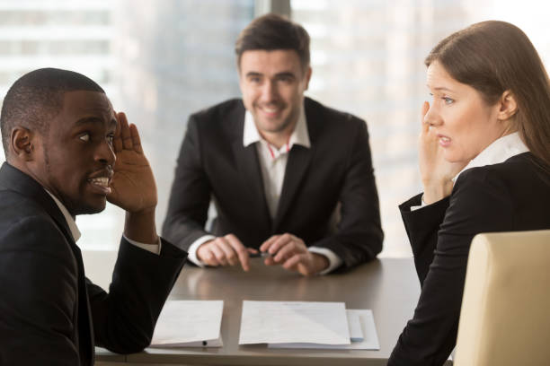 istock Multiracial employers hiding faces, discussing job applicant, bad first impression 695760144