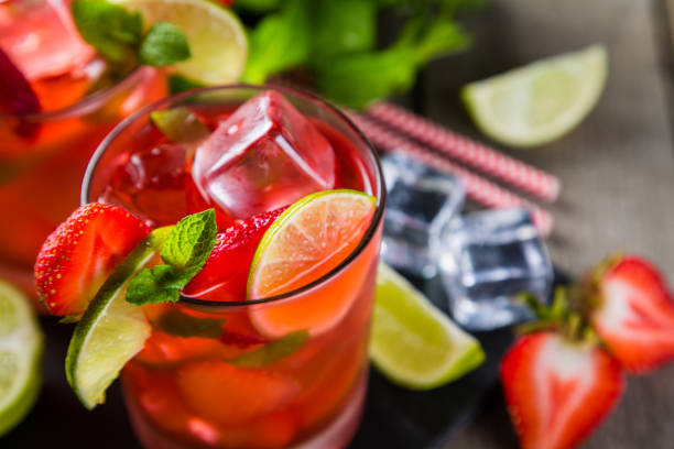 istock Strawberry mojito and ingredients on rustic background 695763550