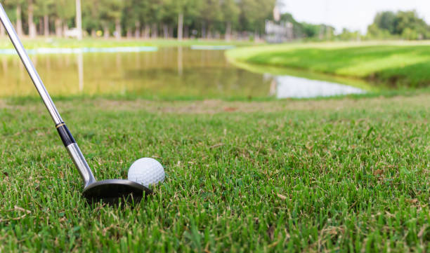 istock Golf ball on white tee and golf club preparing to shot. 695767148