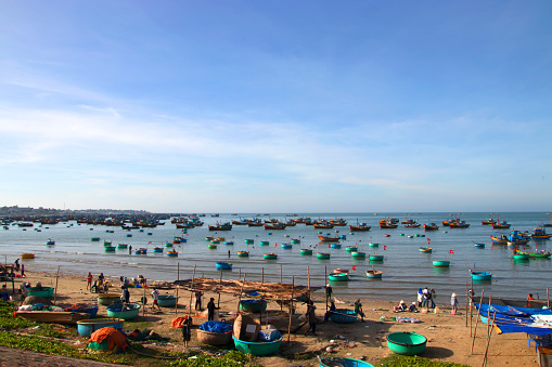 Vietnamese fishing village, Mui Ne, Vietnam, Southeast Asia.in February 23, 2017. Landscape with sea and traditional colorful fishing boats