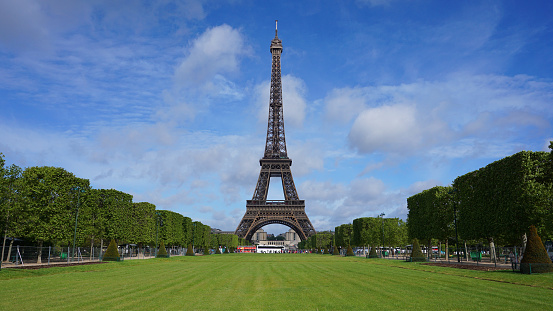 Champ de Mars park, with flowerbed, at the foot of Eiffel Tower. Paris in France