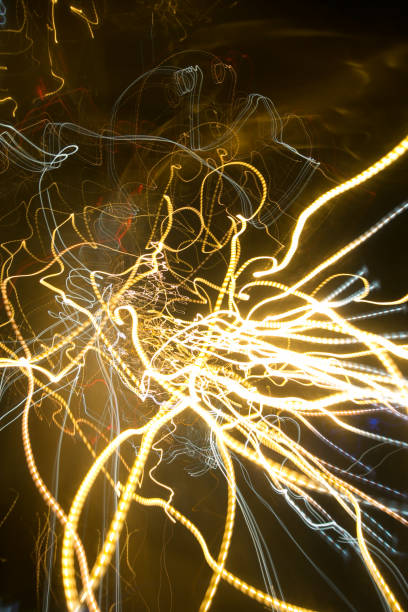 istock Street lights in speeding car in night time, light motion with slow speed shutter. 695779396