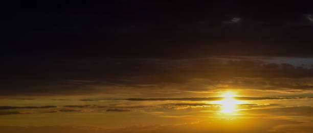istock Beautiful sunset in Russia. Clouds and rays of sun 695779486