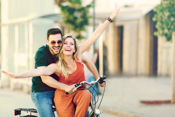 istock Happy Couple Riding a bike 695783514