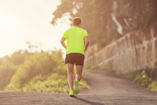 istock Jogging / running sneakers on the asphalt outdoors. 695783598
