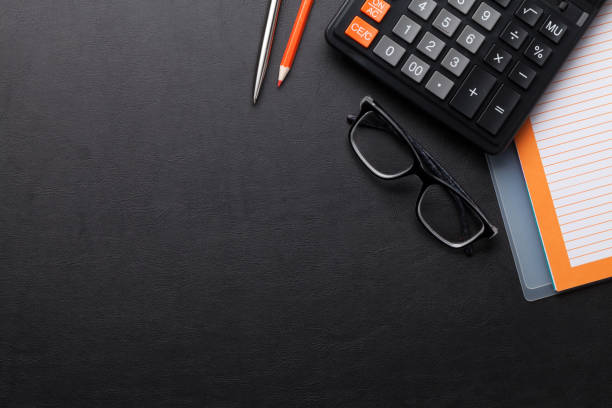 istock Office desk with notepad and supplies 695789322