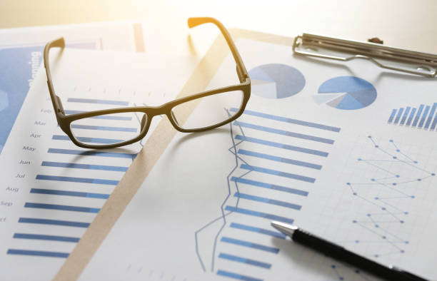 istock Checking financial reports paperwork and Business  Teamwork on Preparing report Blue graphs  glasses 695793420