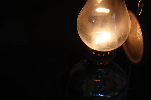 Old lamp illuminates darkness of the night.