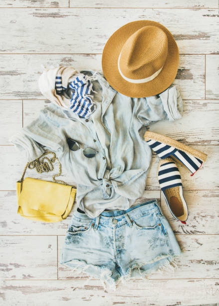istock Pastel summer women's clothes, parquet background, top view 695796896