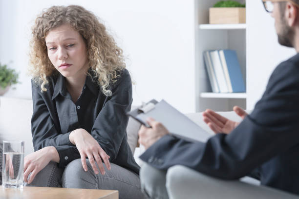istock Therapist talking to his patient 695799262